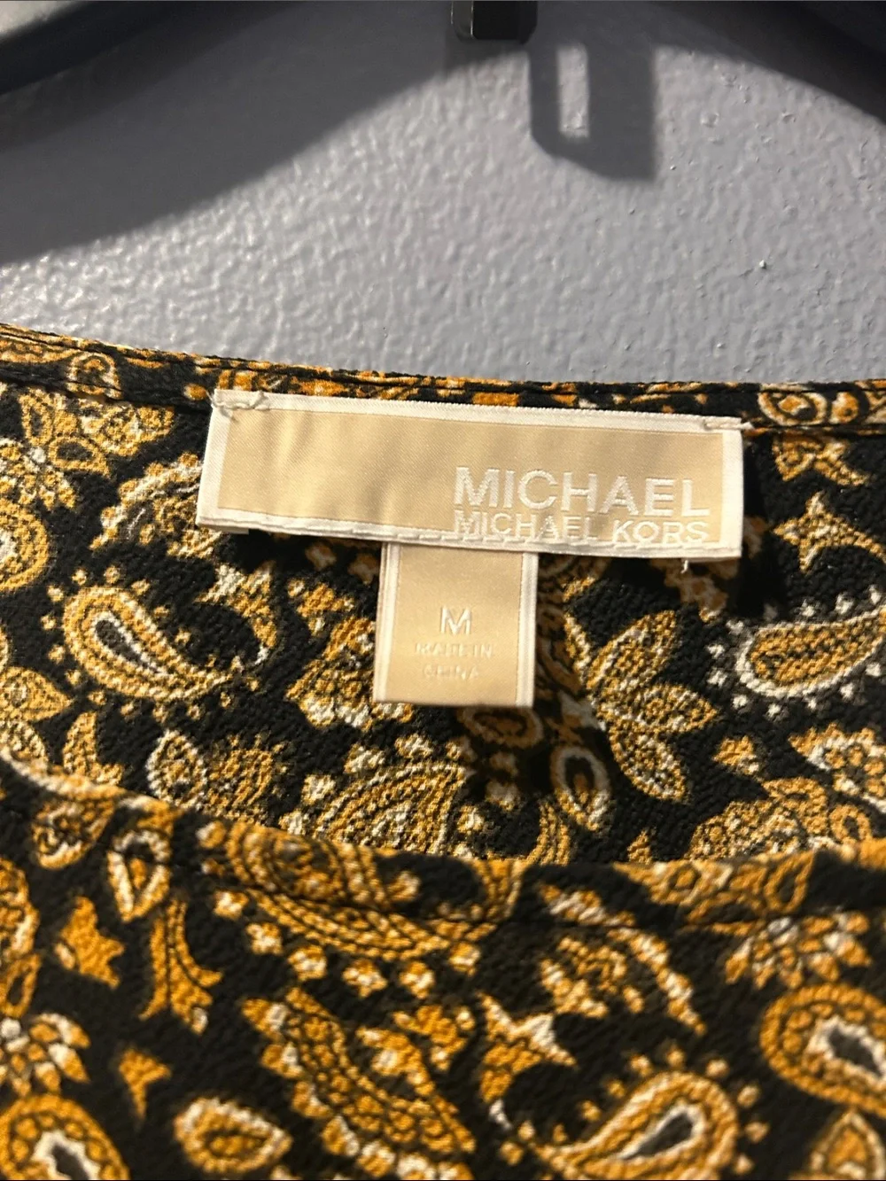 Michael Kors Black Top with Gold Floral Print and Side Tie